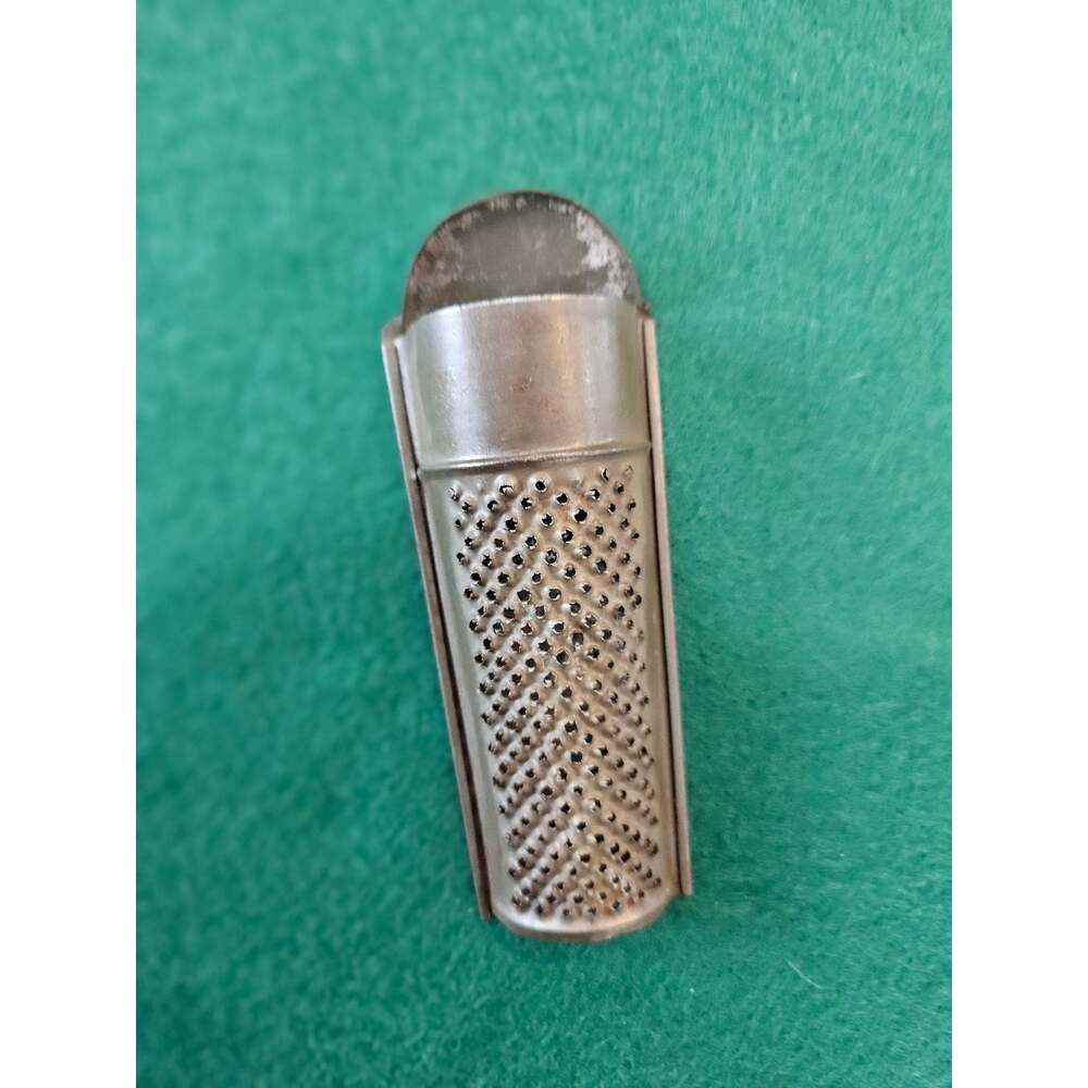 Vintage Tin Nutmeg spice grater kitchen decor.
